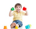 Smiling child boy playing with color toys Royalty Free Stock Photo