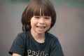 Smiling child face portrait on blurry background