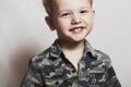 Smiling child. funny little boy. close-up. joy. 4 eyers old. military shirt Royalty Free Stock Photo