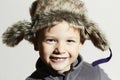 Smiling child in fur Hat.fashion casual winter style.little funny boy.children emotion Royalty Free Stock Photo