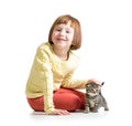 Smiling child girl playing with cat kitten Royalty Free Stock Photo