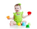 Smiling child girl playing with color toys Royalty Free Stock Photo
