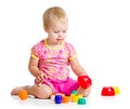 Smiling child girl playing with cup toys Royalty Free Stock Photo