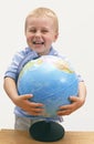 Smiling child with globe Royalty Free Stock Photo