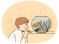 Smiling child look at goldfish in tank Royalty Free Stock Photo