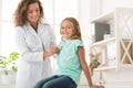 Smiling child patient visiting doctor`s office in clinic Royalty Free Stock Photo