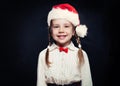 Smiling child in Santa hat portrait. Girl 5 years old Royalty Free Stock Photo