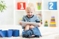 Smiling child sitting on chamber pot with toilet Royalty Free Stock Photo