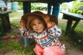 Smiling child in a straw hat in rural style. Rural portrait Royalty Free Stock Photo