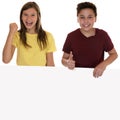 Smiling children with an empty banner and copyspace showing thumbs up Royalty Free Stock Photo