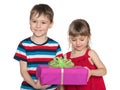 Smiling children hold a gift box