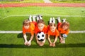 Smiling children lay on grass with golden goblet Royalty Free Stock Photo