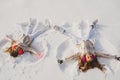 Smiling children lying on snow with copy space. Funny kids making snow angel. Children playing and making a snow angel Royalty Free Stock Photo