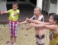 Smiling children make thumbs up outdoor, Sochi, Russia