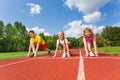 Smiling children in ready position to run