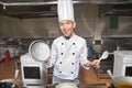 Smiling Chinese cook in kitchen