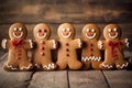 Smiling christmas gingerbread men on wooden background Royalty Free Stock Photo