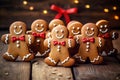 Smiling christmas gingerbread men on wooden background Royalty Free Stock Photo