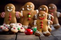 Smiling christmas gingerbread men on wooden background Royalty Free Stock Photo