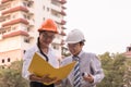 Smiling civil engineer and architect working in a construction s Royalty Free Stock Photo