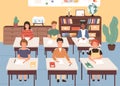 Smiling classmates listening lecture in geography room. Children sitting at desks in classroom. Pupils studying at Royalty Free Stock Photo