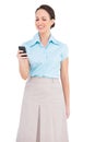 Smiling classy young businesswoman sending text message Royalty Free Stock Photo