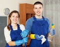 Smiling cleaners team cleaning floor Royalty Free Stock Photo