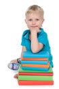 Smiling clever little boy with books