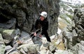 Smiling climber on alpinist route Royalty Free Stock Photo