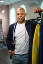 Smiling clothier posing for camera in his tailoring workshop Royalty Free Stock Photo