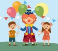 Smiling clown giving balloons to cute boy and girl