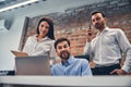 Smiling colleagues discussing new contract in office Royalty Free Stock Photo