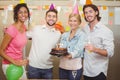 Smiling colleagues enjoying birthday party Royalty Free Stock Photo