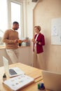 Smiling Colleagues Talking Office. Happy Business Couple Drinking Coffee Royalty Free Stock Photo