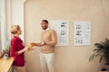 Smiling Colleagues Talking Office. Happy Business Couple Drinking Coffee Royalty Free Stock Photo