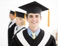 College graduate at graduation with classmates Royalty Free Stock Photo