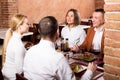 Company of friends eating delicious dinner Royalty Free Stock Photo