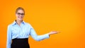 Smiling company worker pointing template orange background, business training