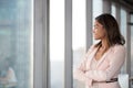 Smiling confident african businesswoman looking at window thinking about future Royalty Free Stock Photo