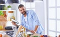 Smiling and confident chef standing in large kitchen Royalty Free Stock Photo