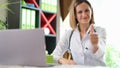 Smiling confident doctor approvingly raising thumbs up Royalty Free Stock Photo