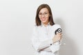 Smiling confident beautiful young doctor woman with stethoscope, glasses isolated on white background. Female doctor in medical Royalty Free Stock Photo