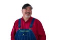 Smiling confident farmer or worker in dungarees Royalty Free Stock Photo