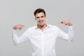 Smiling confident man pointing on himself Royalty Free Stock Photo