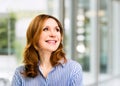 Smiling confident stylish mature middle aged woman at office. Senior businesswoman, executive business leader manager Royalty Free Stock Photo