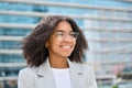 Smiling young African American business woman wearing eyeglasses looking away. Royalty Free Stock Photo