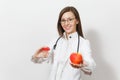 Smiling confident young doctor woman with stethoscope, glasses isolated on white background. Female doctor in medical Royalty Free Stock Photo