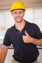 Smiling construction worker giving thumbs up Royalty Free Stock Photo