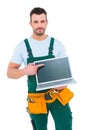 Smiling construction worker holding laptop Royalty Free Stock Photo