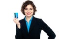 Smiling corporate woman holding credit card Royalty Free Stock Photo